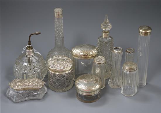 Twelve assorted silver mounted glass toilet jars, etc.